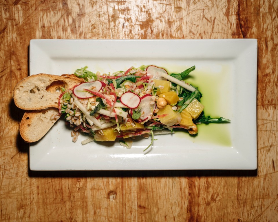 <strong>The farro golden beet salad is one of River Oak&rsquo;s more popular items on the menu. The dish includes chunks of golden beets, hazelnut, farro and watermelon-radish slices.</strong> (Houston Cofield/Special To The Daily Memphian)