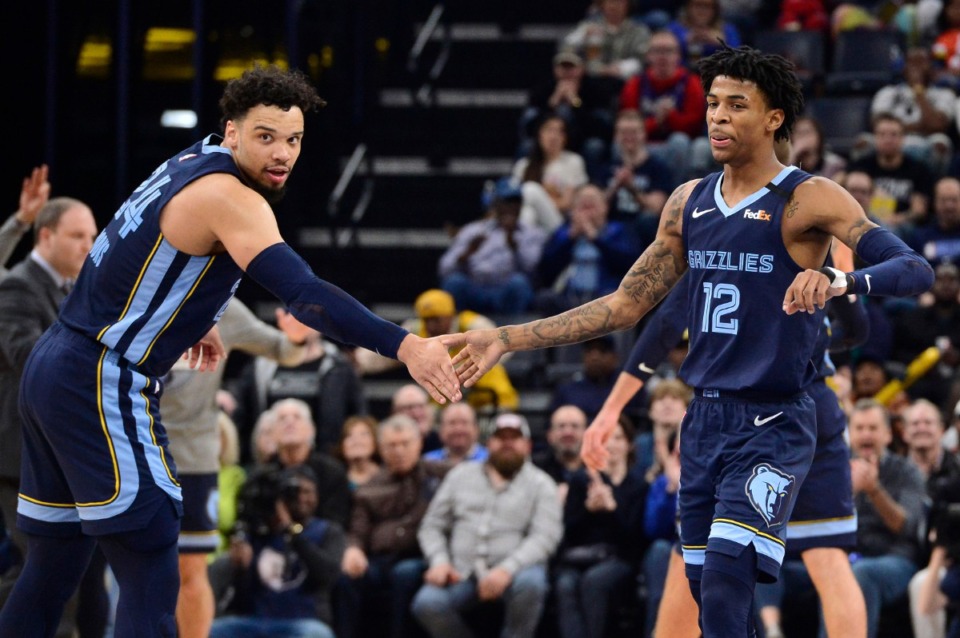 <strong>Memphis Grizzlies guards Dillon Brooks (24) and Ja Morant (12) give each other five in the second half of an NBA basketball game against the Atlanta Hawks Saturday, March 7, 2020, at FedExForum.</strong> (Brandon Dill/AP)