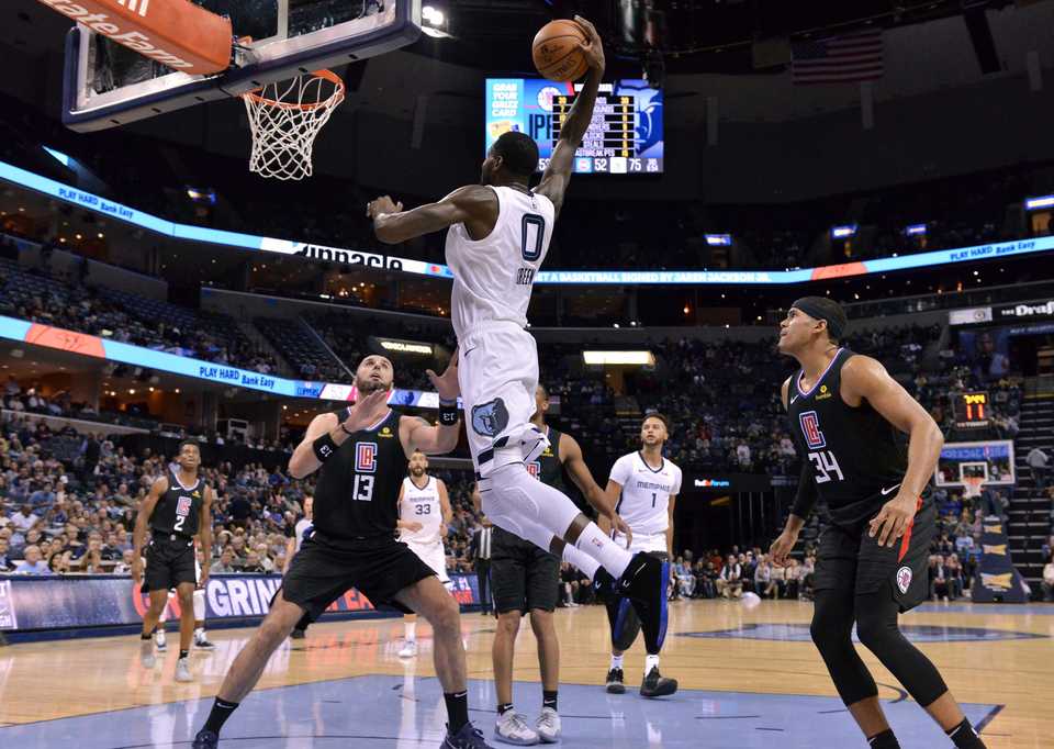 <strong>Memphis Grizzlies forward JaMychal Green (0) dunks the ball against Los Angeles Clippers center Marcin Gortat (13) in the second half of an NBA basketball game Wednesday, Dec. 5, 2018, in Memphis, Tenn. </strong>(AP Photo/Brandon Dill)