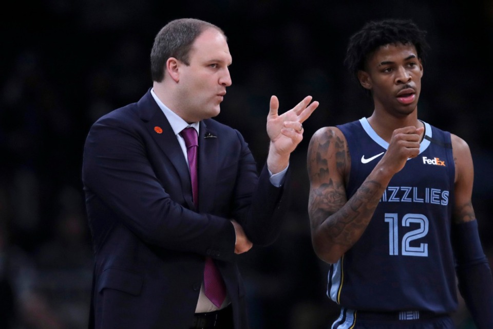 <strong>Memphis Grizzlies head coach Taylor Jenkins talks with guard Ja Morant during a time out in a game against the Celtics in Boston on Jan. 22.</strong> <strong>Twenty-two NBA teams, including the Grizzlies, entered the league&rsquo;s Disney &ldquo;bubble&rdquo; in Orlando this week.</strong> (Charles Krupa/Associated Press file)