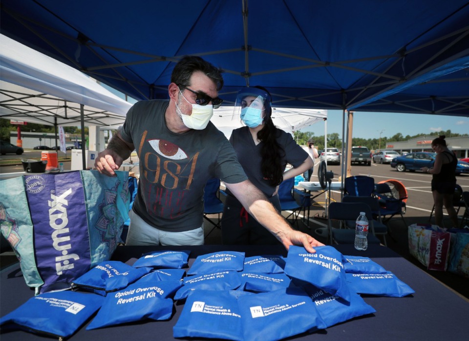 <strong>Josh Weil (left) and Diana Abu-Obeid help pass out opioid overdose reversal kits in Frayser July 11, 2020.</strong> (Patrick Lantrip/Daily Memphian)