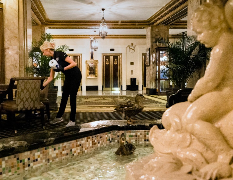 <strong>Peabody Hotel Spa Manager Katie Williams performs double duty as she sanitizes the common areas inside Peabody Hotel in Downtown Memphis on April 3, 2020.</strong>(Ziggy Mack)