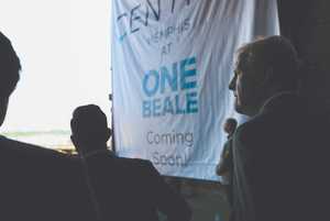 <p class="p1"><span class="s1"><strong>Kevin Kane, president and CEO of Memphis Tourism, listens as Chance Carlisle of Carlisle Corp. announces in July 2018 his company's plans for the One Beale building.</strong> (Houston Cofield/Daily Memphian file)</span>