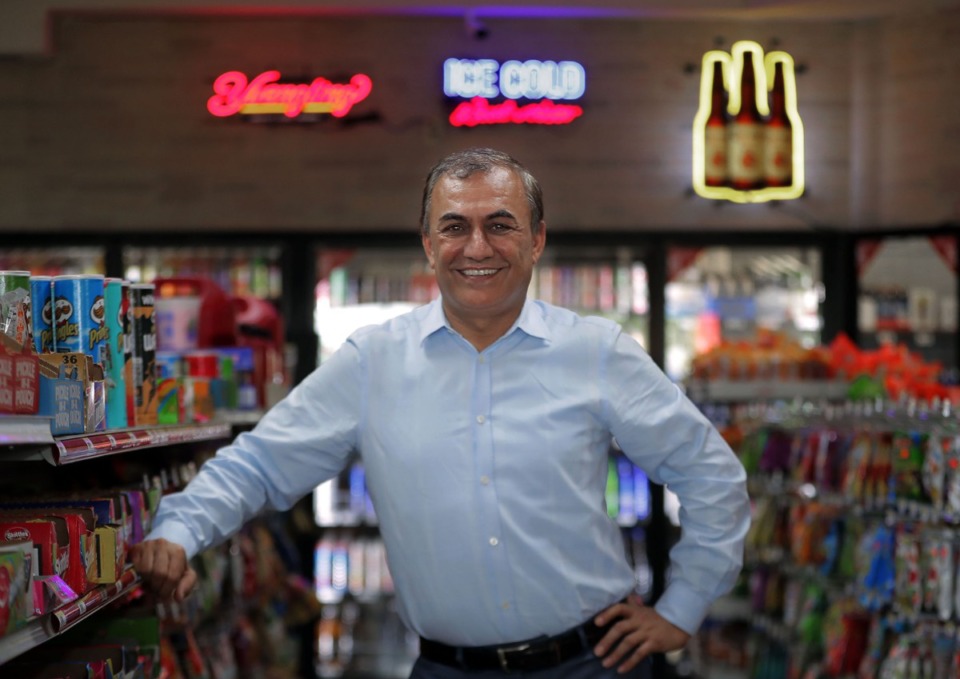 <strong>Rooziman Shah poses for a portrait at his convenience store located on Germantown Road, just south of the state line July 22, 2020.</strong> (Patrick Lantrip/Daily Memphian)
