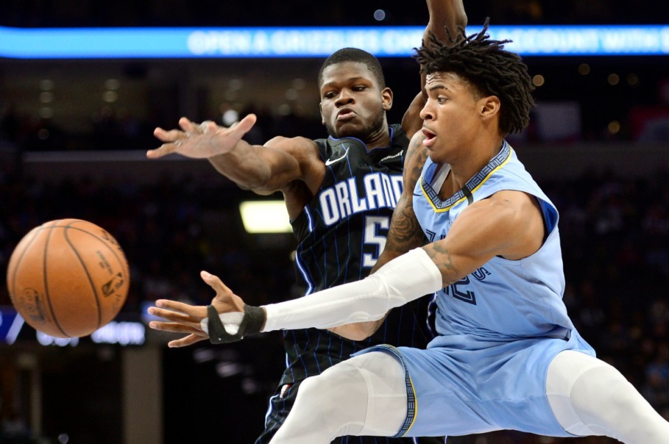 <strong>Grizzlies guard Ja Morant, right, plays against Orlando on in March at FedExForum. Forget dealing with a rookie wall or stumbling into the playoffs exhausted and banged-up. The NBA's break for the coronavirus pandemic gave rookies an offseason within a season. They have had the chance to heal up, study lots of film and gain some much-needed pounds to better handle the grueling season in a league filled with savvy veterans.</strong> (Brandon Dill/AP file)