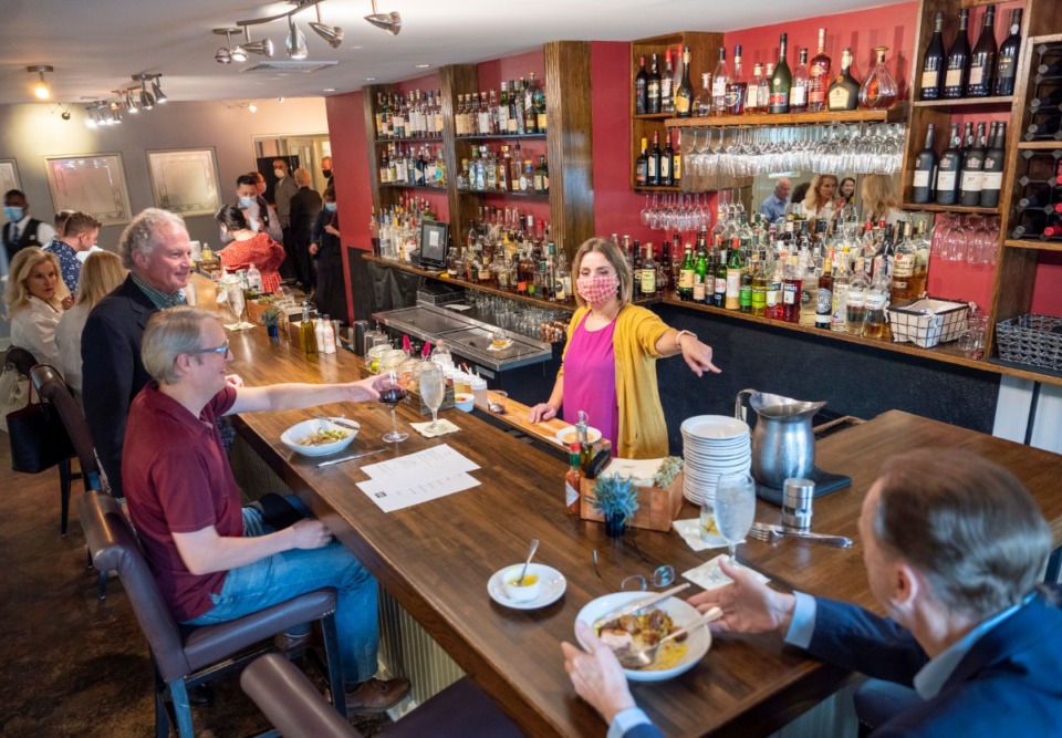 <strong>Erling Jensen bartender Maggie McLendon directs a patron in the new bar area Friday, June 5, 2020.</strong> (Greg Campbell/Special for The Daily Memphian)