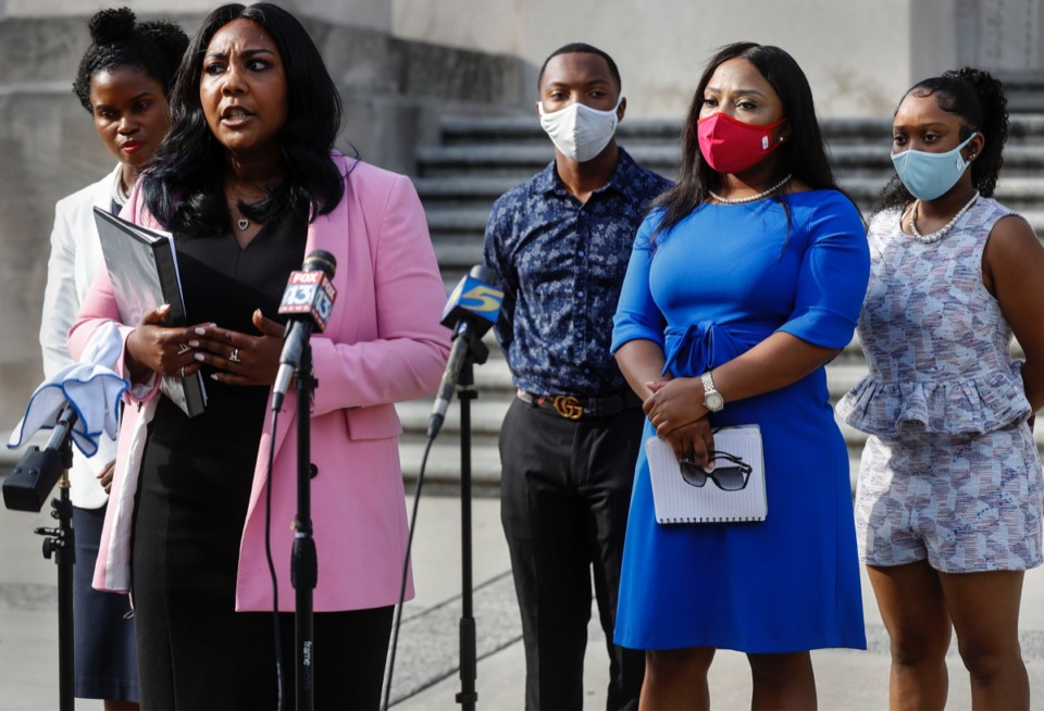 <strong>State Sen. Katrina Robinson (second right) attends a press conference with her family and attorneys on the steps of the D&rsquo;Army Bailey Courthouse on Wednesday, July 29. Robinson has been charged with theft and embezzlement involving government programs and wire fraud. She allegedly stole more than $600,000 from her business, The Healthcare Institute.</strong> (Mark Weber/Daily Memphian)
