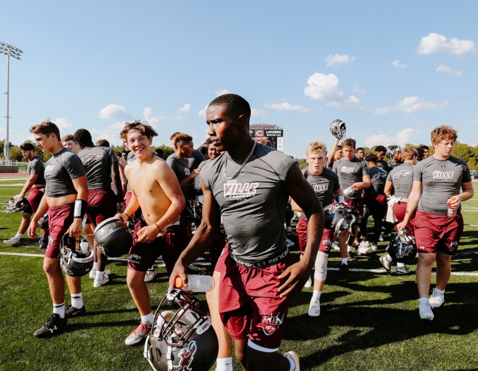 <strong>In this file photo, the Collierville High football team jogs to the locker room after a Thursday evening practice Sept. 20, 2018.</strong> (Houston Cofield/Daily Memphian file)