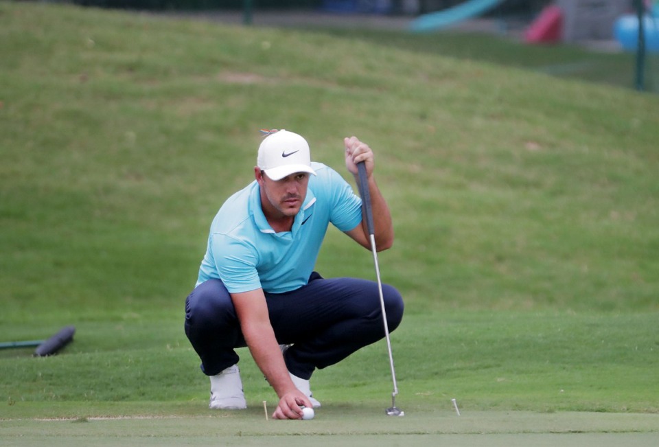 <strong>Defending champion Brooks Koepka lines up a putt on the 17th hole at TPC Southwind in Memphis Thursday July 30, 2020.</strong> (Patrick Lantrip/Daily Memphian)