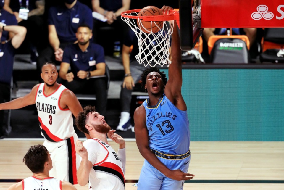 <strong>Memphis Grizzlies' Jaren Jackson Jr. dunks the ball during the second half against the Portland Trail Blazers on Friday, July 31, in Orlando. The Grizzlies lost 140-135 in overtime.</strong>&nbsp;(Mike Ehrmann/Associated Press)
