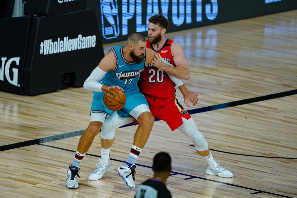 <strong>Memphis Grizzlies' Jonas Valanciunas (17) drives on New Orleans Pelicans' Nicolo Melli (20) during the second half of an NBA basketball game Monday, Aug. 3, 2020 in Lake Buena Vista, Fla.</strong> (Ashley Landis/AP pool)