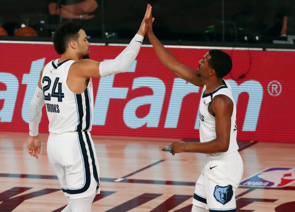 <strong>Memphis Grizzlies guard Dillon Brooks (24) and guard De'Anthony Melton (0) celebrate after a play against the Oklahoma City Thunder on Friday, Aug. 7, in Lake Buena Vista, Fla. The Grizzlies won 121-92.</strong> (Kim Klement/Associated Press)