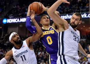 <strong>Los Angeles Lakers guard Lonzo Ball (2) struggles for control of the ball against Memphis Grizzlies guard Mike Conley (11) and center Marc Gasol (33) in the first half of an NBA game on Saturday, Dec. 8, 2018, in Memphis.</strong> (AP Photo/Brandon Dill)