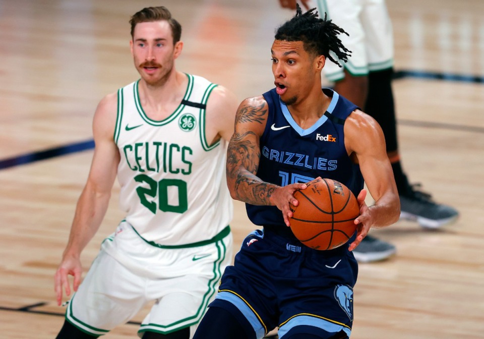 <strong>Memphis Grizzlies&rsquo; Brandon Clarke (15) handles the ball as Boston Celtics&rsquo; Gordon Hayward (20) defends during the second half of their game on Tuesday, Aug. 11, in Lake Buena Vista, Fla.</strong> (Mike Ehrmann/Associated Press)