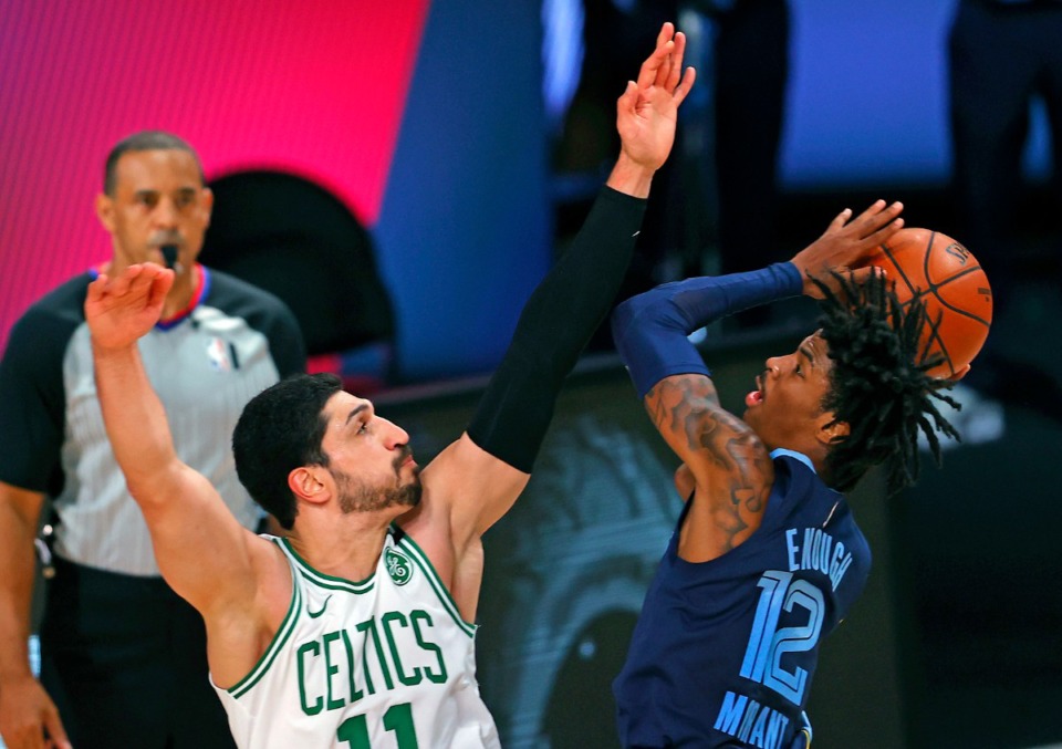 <strong>Boston Celtics' Enes Kanter, left, defends against Memphis Grizzlies' Ja Morant (12) during the second half of an NBA basketball game Tuesday, Aug. 11, 2020, in Lake Buena Vista, Fla.</strong> (Mike Ehrmann/AP photo via pool)