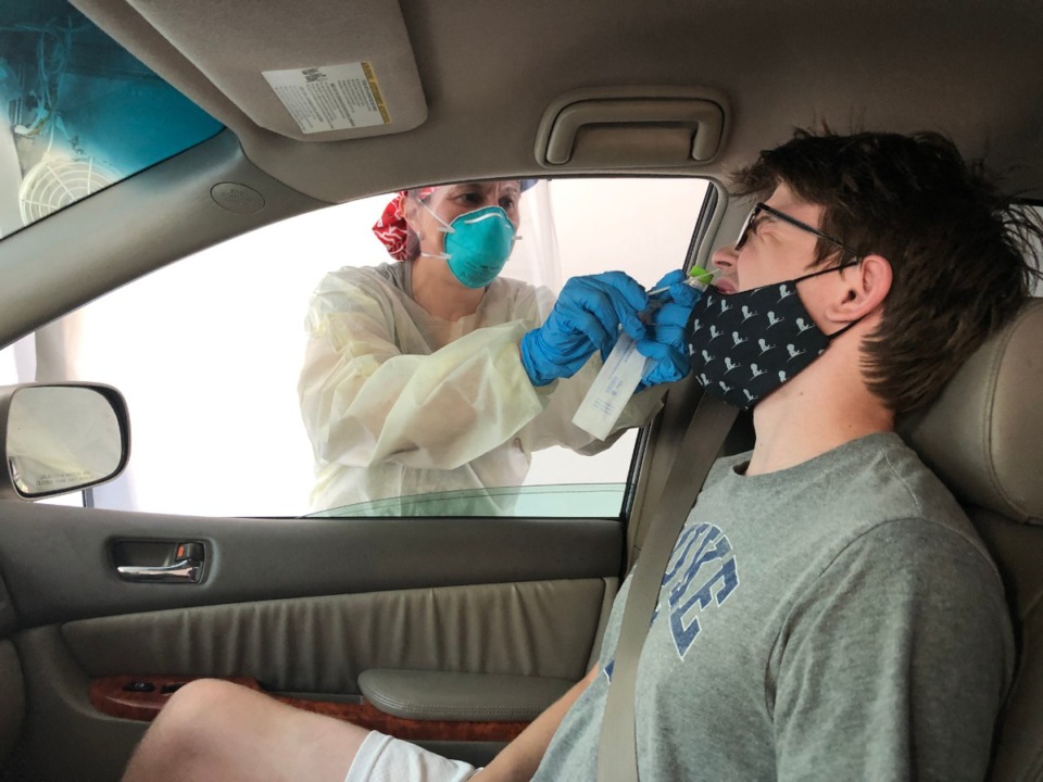 <strong>Peter Calkins endures coronavirus testing at a drive-thru facility at Duke University.</strong> (Geoff Calkins/Daily Memphian)