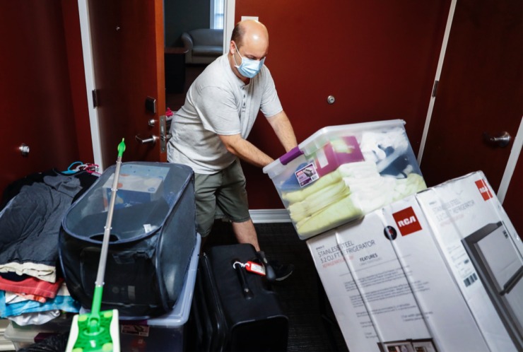 <strong>Christian Brothers University parent Mike Bowen hauls his daughter Jessica&rsquo;s (not pictured) dorm room supplies during freshman move-in day on Tuesday, August 11, 2020.</strong> (Mark Weber/Daily Memphian)