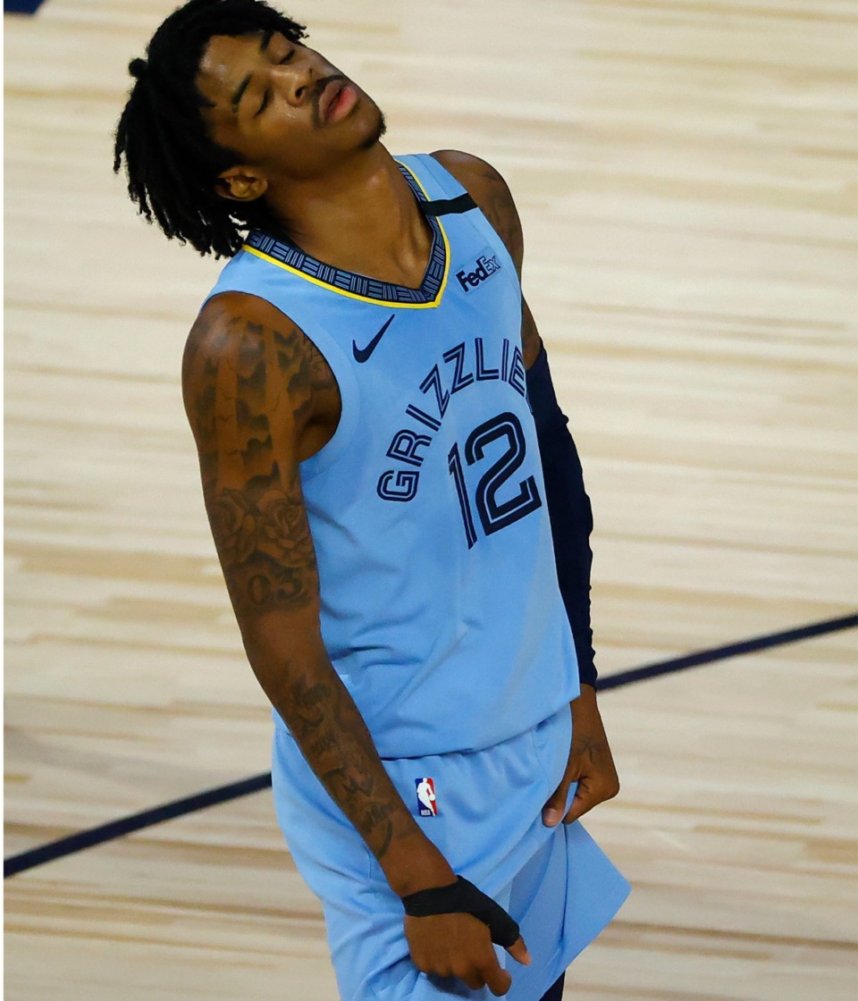 <strong>Ja Morant (wearing a brace on his right thumb) reacts after the Memphis Grizzlies&rsquo; loss to the Portland Trail Blazers Saturday, Aug. 15, 2020, in Lake Buene Vista, Fla.</strong> (Kevin C. Cox/AP)