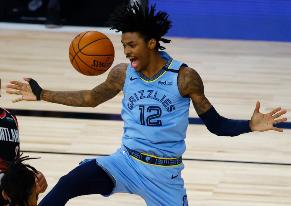 <strong>Memphis Grizzlies' Ja Morant reacts after a dunk against the Portland Trail Blazers during the second half of an NBA basketball game Saturday, Aug. 15, 2020, in Lake Buena Vista, Fla.</strong> (Kevin C. Cox/AP)