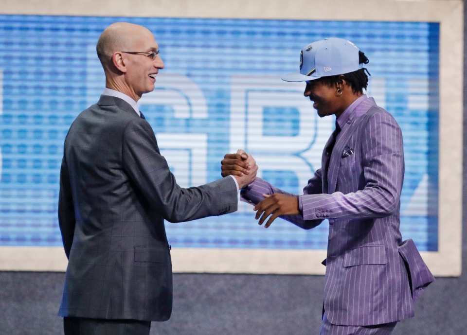 <strong>Ja Morant, right, was greeted by NBA Commissioner Adam Silver after being selected by the Memphis Grizzlies on Thursday, June 20, 2019, in New York.</strong> (AP file Photo/Julio Cortez)