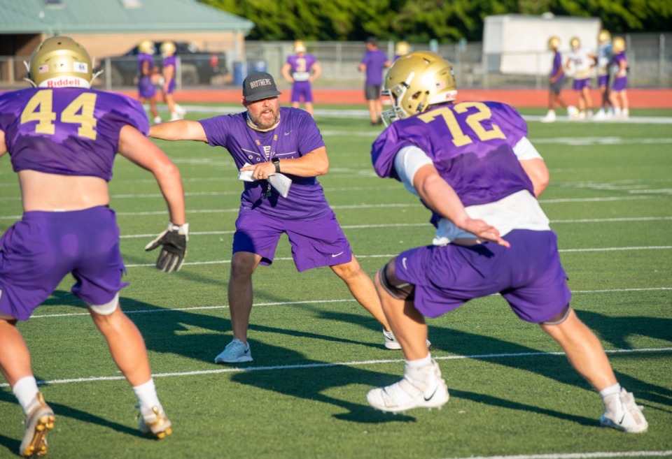 <strong>CBHS head football coach Thomas McDaniel works with his linemen during practice Monday, August 17, 2020.</strong> (Greg Campbell/Special to The Daily Memphian)