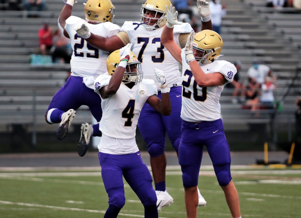 <strong>CBHS lineman Zach Davenport (73) leaps up to celebrate with his teammates during an Aug. 21, 2020 game against Houston.</strong> (Patrick Lantrip/Daily Memphian)