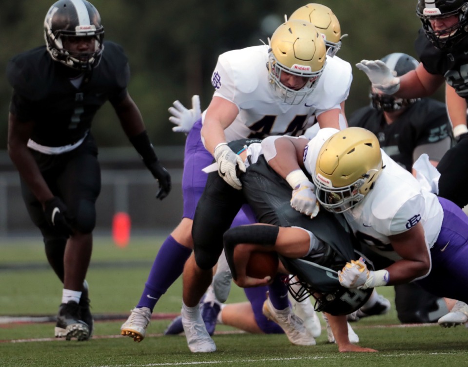 <strong>Houston running back Ben Stegall (2) gets taken down by the CBHS defense during an Aug. 21, 2020 home game.</strong> (Patrick Lantrip/Daily Memphian)