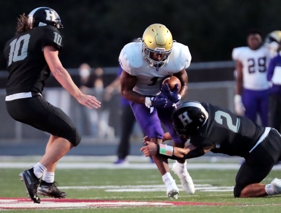 <strong>A CBHS running back is tackled by Houston defenders Aug. 21, 2020.</strong> (Patrick Lantrip/Daily Memphian)