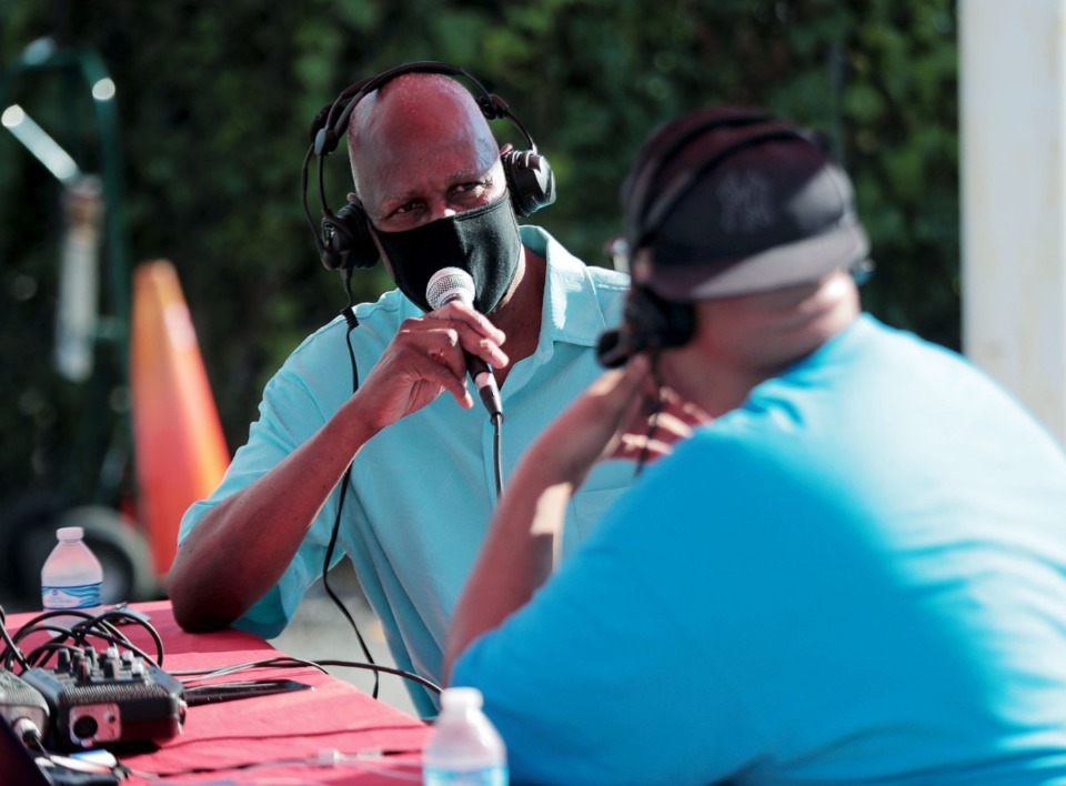 <strong>Former Memphis mayor Willie Herenton (left) talks with 88.5FM radio personality Kavaunjay, who was broadcasting live from Dr. Charles Champion's 90th birthday parade on Saturday, Aug. 22.</strong> (Patrick Lantrip/Daily Memphian)
