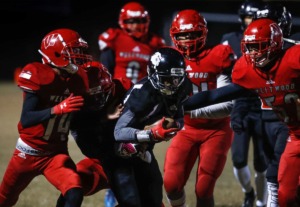 <strong>Middle College punter returner Joyner Stephens (middle) runs for positive yards against the Westwood defense during action in their high school football game Thursday, Oct. 31, 2019.</strong> (Mark Weber/Daily Memphian file)