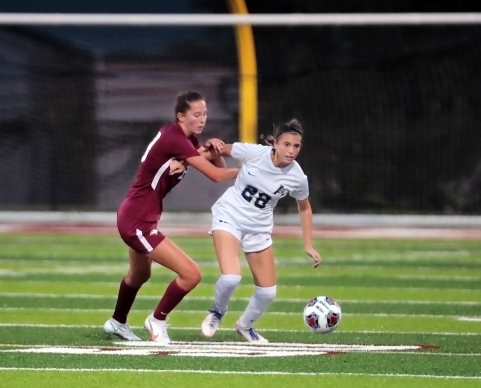 <strong>Arlington High School's Aspen Bailey (28) fights for the ball during an Aug. 25, 2020, game at Evangelical Christian School.</strong> (Patrick Lantrip/Daily Memphian)