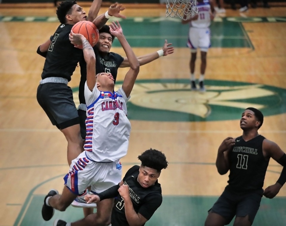 <strong>Jalen Brown (3) is fouled by Mitchell players while playing for Wooddale on Feb. 15, 2020.</strong>&nbsp;<strong>Brown is transferring to Tennessee Prepatory Academy.</strong> (Jim Weber/Daily Memphian)