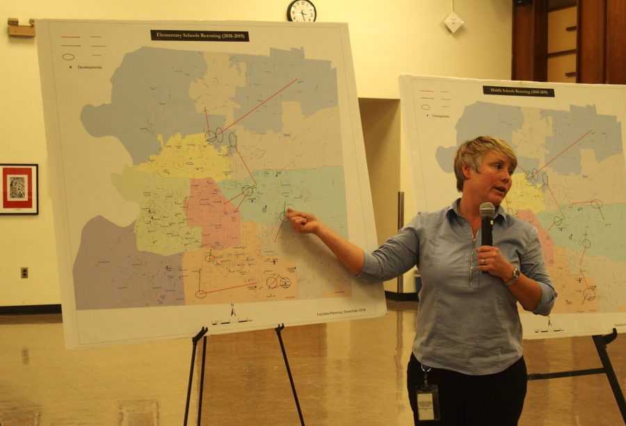 <strong>Michelle Stuart, the district&rsquo;s manager of facility planning and property management, presents a plan to consolidate 28 schools into 10 new buildings</strong>. (Laura Faith Kebede/Chalkbeat)