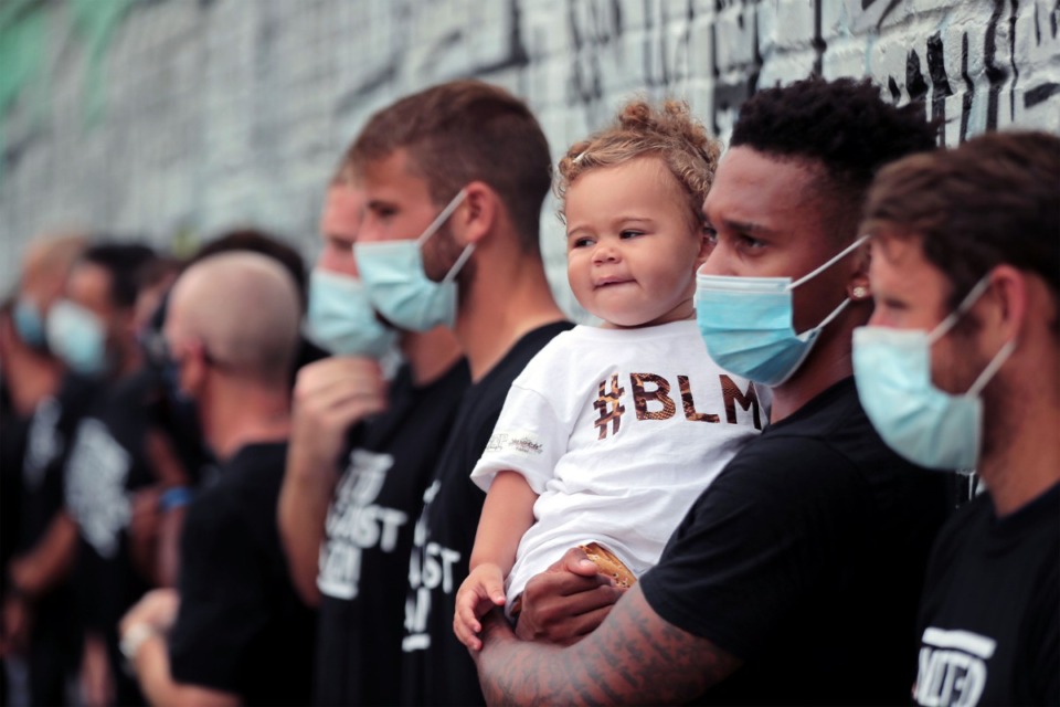 <strong>Memphis 901 FC forward Keanu Marsh-Brown holds his daughter Athalia in front of the I Am a Man mural in South Main Aug. 29, 2020.</strong> (Patrick Lantrip/Daily Memphian)