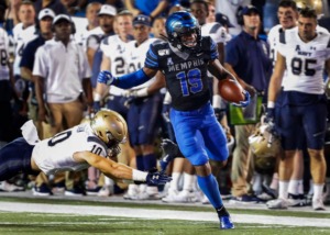<strong>Memphis running back Kenneth Gainwell (right) scrambles past Navy defender Vincent Thomas Jr. (left) on his way to a 75 yard touchdown during action in their college football game at the Liberty Bowl Memorial Stadium Thursday, Sept. 26, 2019.</strong> (Mark Weber/Daily Memphian file)