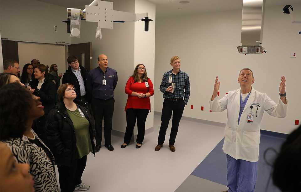 <strong>Thomas Fields shows a group of onlookers state-of-the-art surgical equipment during a Shorb Tower preview and centennial celebration on the Methodist University Hospital campus Wednesday, Dec. 12.</strong> (Patrick Lantrip/Daily Memphian)