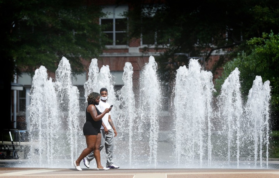 <strong>Students walk by the Student Plaza fountain on the University of Memphis campus on Tuesday, Aug. 25.&nbsp;Even with a remote-learning start due to the COVID-19 pandemic, fall enrollment is up 2.5%, making the campus second only to the University of Tennessee-Knoxville in size.</strong>&nbsp;(Mark Weber/Daily Memphian)