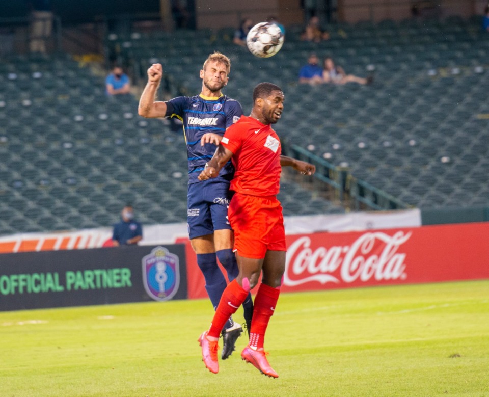 <strong>Zach Carroll, Memphis 901 FC midfielder battles Birmingham Legion&rsquo;s Brian Wright during Saturday&rsquo;s 1-1 tie at AutoZone Park.</strong> (Greg Campbell/Special to Daily Memphian)