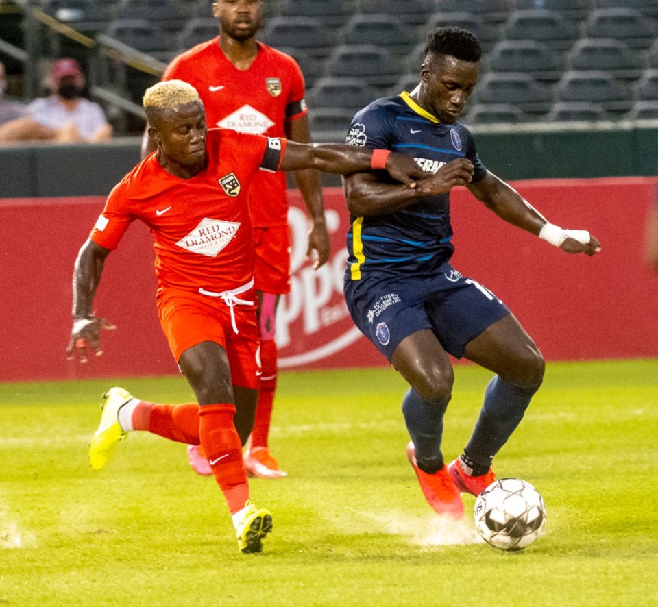 <strong>Memphis 910 FC's Jean-Christophe Koffi fends off Birmingham Legion's Asiedu during the first half play Saturday, September 5, 2020 at AutoZone Park. Memphis and Birmingham played to a 1-1 tie.</strong> (Greg Campbell/Special to Daily Memphian)