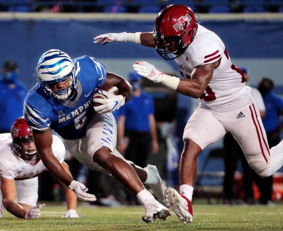 <strong>University of Memphis tight end Sean Dykes (5) dodges an Arkansas State defender during the Tigers' home opener at the Liberty Bowl Sept. 5, 2020.</strong> (Patrick Lantrip/Daily Memphian)