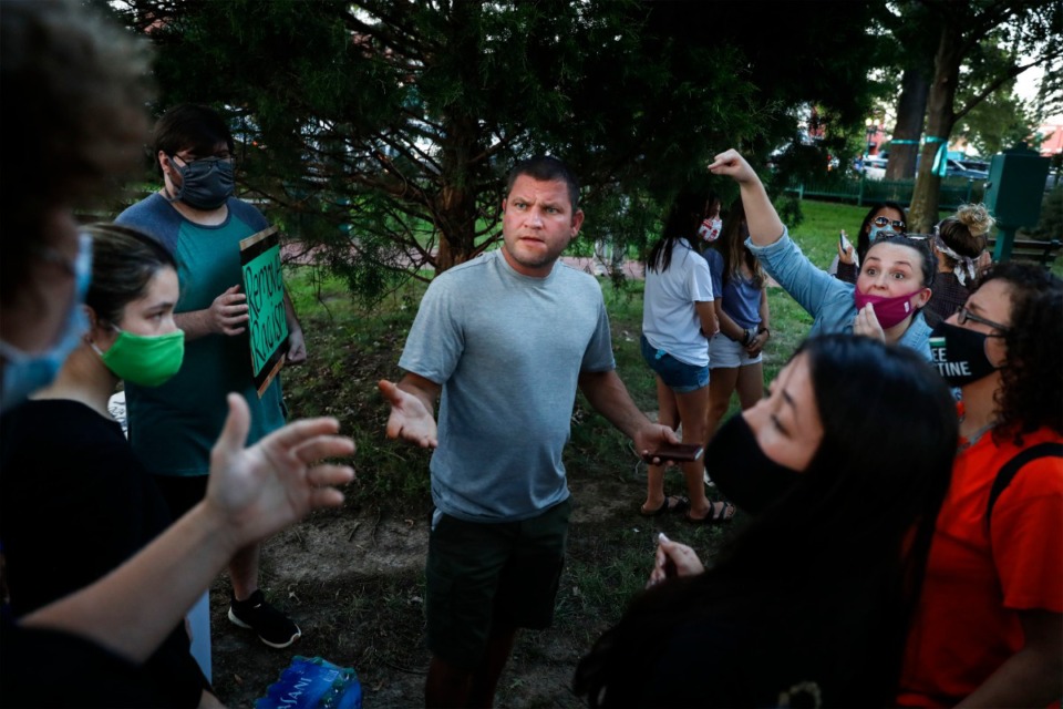 <strong>Bystanders speak to protesters during a sit-in at Town Square Park on Monday, Sept. 7, 2020 in Collierville.</strong> (Mark Weber/The Daily Memphian)