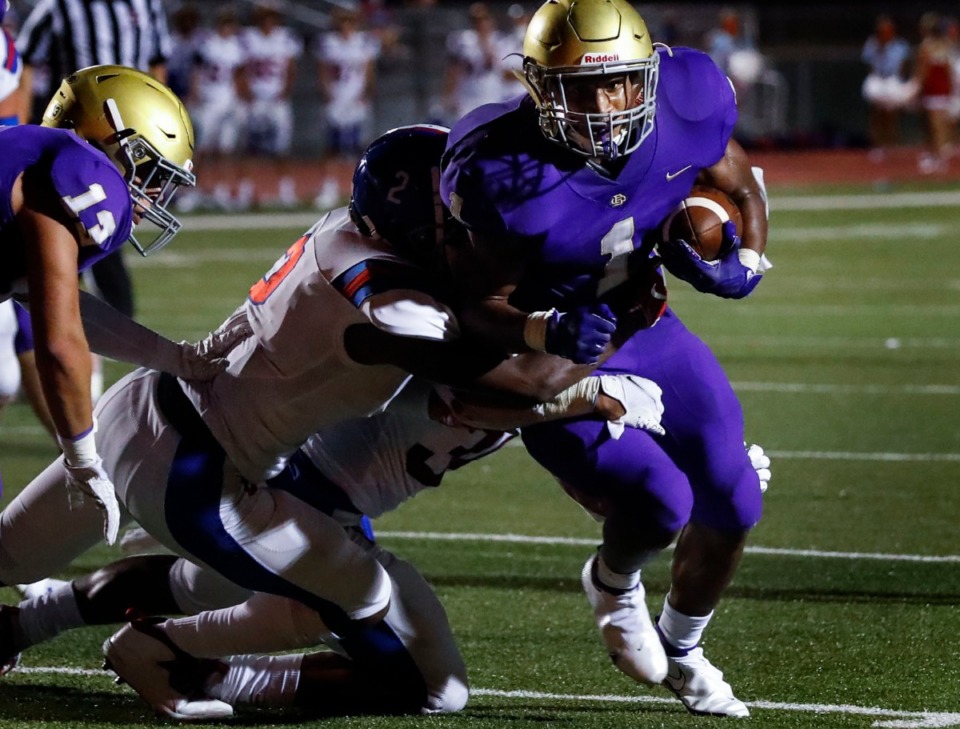 <strong>CBHS running back Dallan Hayden (right) scrambles past the MUS defense for a first down on Friday, Sept. 4, 2020.</strong> (Mark Weber/Daily Memphian file)