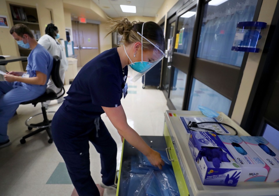 <strong>Registered nurse Ali Durbin gears up to go inside a COVID-positive patient room at Regional One Sept. 11, 2020</strong>. (Patrick Lantrip/Daily Memphian)