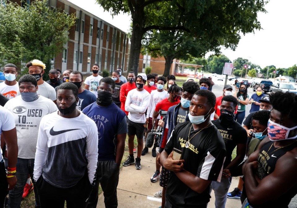 <strong>Student athletes and parents gather outside the Shelby County Schools Board of Education building on Wednesday, Sept. 16, as they protest the district&rsquo;s decision to cancel fall sports.&nbsp;The protest was organized by Kaleb Almo, a senior at Kirby High, who took to social media to ask players and coaches from across the county to &ldquo;peacefully voice our opinion&rdquo; to school administrators with &ldquo;MASKS ON.&rdquo;</strong> (Mark Weber/Daily Memphian)