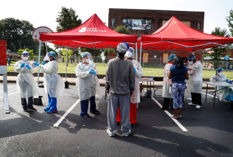 <strong>Christ Community Health Services staff members collect nasal swabs during a walk-up coronavirus testing on September 17, 2020, at Orange Mound Health Center.</strong> (Mark Weber/Daily Memphian)