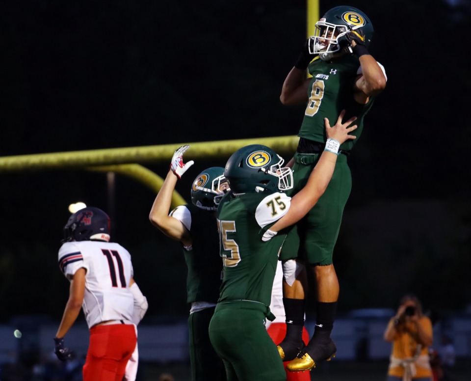 <strong>Briarcrest receiver Jerrod Gentry (8) is hoisted up by teammates after scoring the opening touchdown against St. Benedict on Sept. 18, 2020.</strong> (Patrick Lantrip/Daily Memphian)