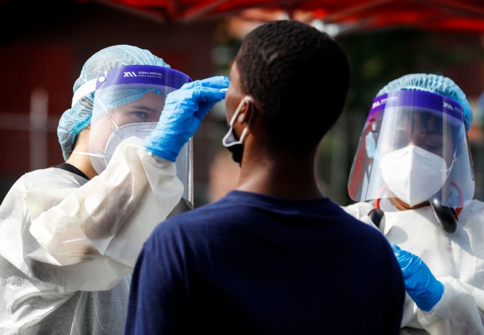 <strong>Christ Community Health Services staff members collect nasal swabs during a walk-up coronavirus testing on Sept. 17, 2020 at Orange Mound Health Center.</strong> (Mark Weber/The Daily Memphian)