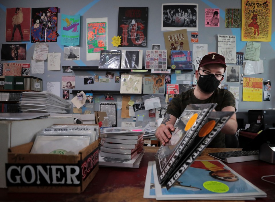 <strong>Zac Ives and Eric Friedl are the co-owners of Goner Records (where employee Cole Wheeler sorts through vinyl records and books Aug. 27, 2020) and they&rsquo;re also the organizers of GonerFest, which is going virtual this year.</strong> (Patrick Lantrip/Daily Memphian)