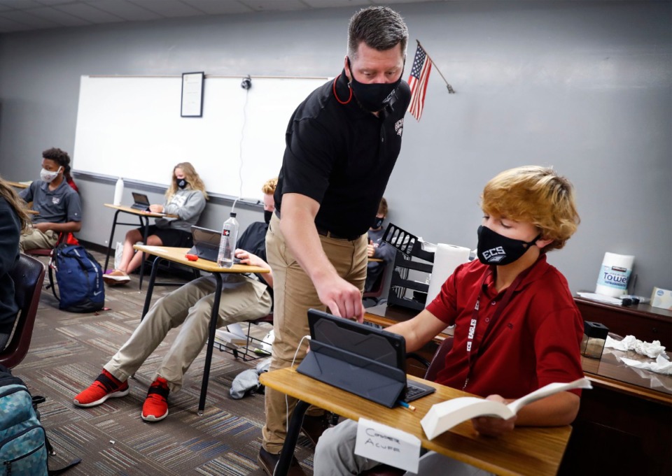 <strong>Evangelical Christian School Literature teacher Andy Gross (left) works with eighth grade student Cooper Acuff (right) on Thursday, Sept. 10, 2020.</strong> (Mark Weber/The Daily Memphian)