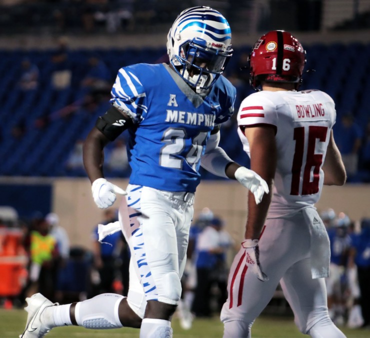 University of Memphis running back Cameron Fleming (24) jogs past an Arkansas State University defender after a play during the Tigers&rsquo; home opener at the Liberty Bowl Memorial Stadium Sept. 5, 2020. (Patrick Lantrip/Daily Mempian)